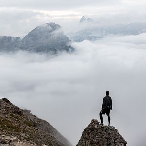 Preview wallpaper man, loneliness, alone, traveler, rocks, fog