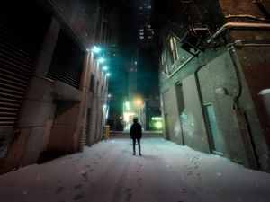 Preview wallpaper man, loneliness, buildings, night city, snow