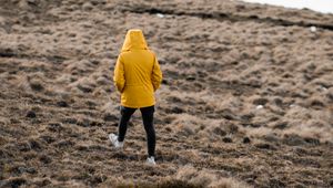 Preview wallpaper man, loneliness, jacket, yellow, walk