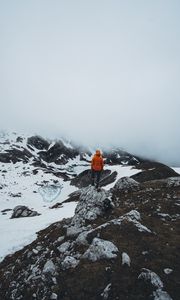Preview wallpaper man, loneliness, solitude, snow, stones, fog