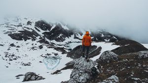 Preview wallpaper man, loneliness, solitude, snow, stones, fog