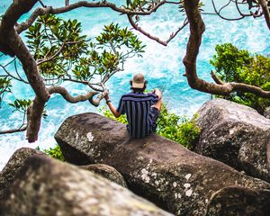 Preview wallpaper man, loneliness, stones, sea, solitude