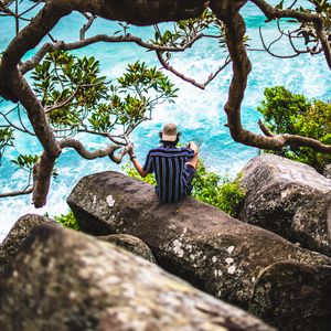 Preview wallpaper man, loneliness, stones, sea, solitude