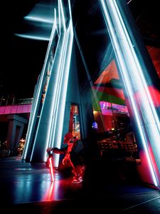 Preview wallpaper man, mask, alone, neon, street, building, architecture