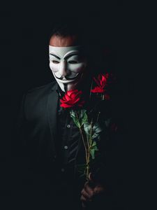 Preview wallpaper man, mask, anonymous, roses, flowers, bouquet