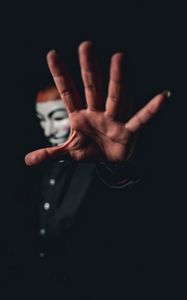 Preview wallpaper man, mask, anonymous, hand, gesture