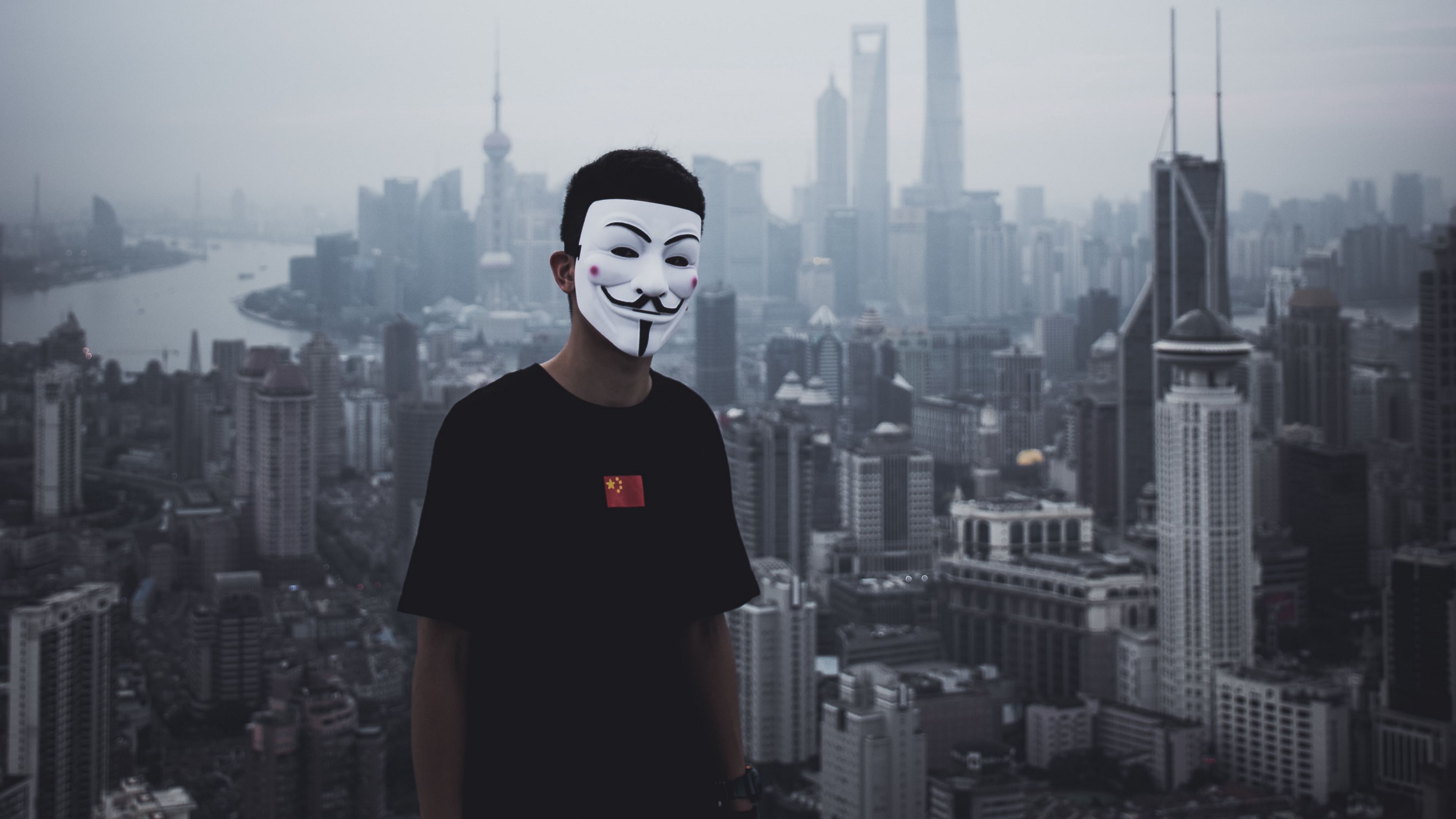 Download wallpaper 3840x2160 man, mask, city, buildings, view, overview