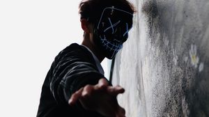 Preview wallpaper man, mask, hand, fingers, touch