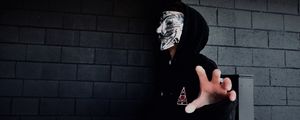 Preview wallpaper man, mask, hand, touch