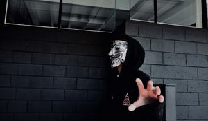 Preview wallpaper man, mask, hand, touch