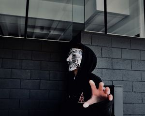 Preview wallpaper man, mask, hand, touch
