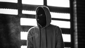 Preview wallpaper man, mask, hood, hoodie, bw