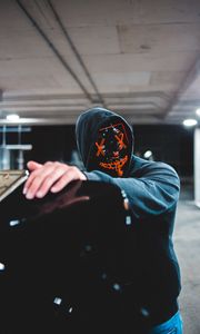 Preview wallpaper man, mask, hood, hand