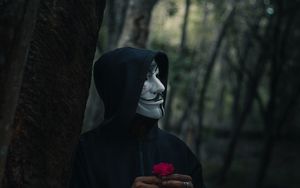 Preview wallpaper man, mask, hood, anonymous, forest