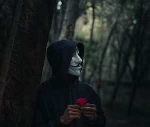 Preview wallpaper man, mask, hood, anonymous, forest