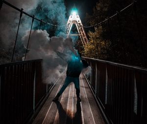 Preview wallpaper man, mask, neon, smoke, bridge