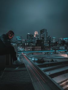 Preview wallpaper man, mask, roof, city, night