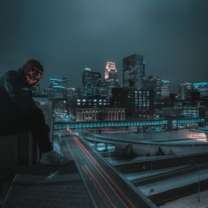 Preview wallpaper man, mask, roof, city, night