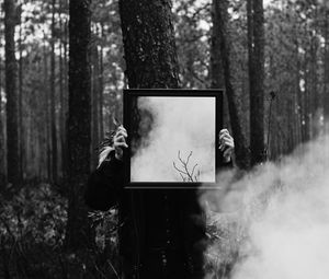 Preview wallpaper man, mirror, smoke, bw, forest