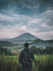 Preview wallpaper man, mountain, volcano, nature, landscape