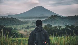 Preview wallpaper man, mountain, volcano, nature, landscape