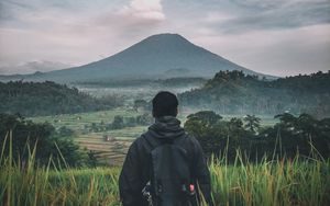 Preview wallpaper man, mountain, volcano, nature, landscape