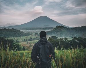 Preview wallpaper man, mountain, volcano, nature, landscape