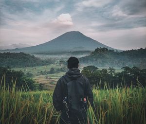 Preview wallpaper man, mountain, volcano, nature, landscape