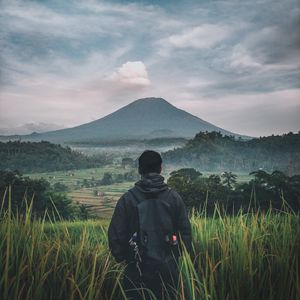 Preview wallpaper man, mountain, volcano, nature, landscape