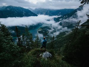 Preview wallpaper man, mountains, clouds, travel