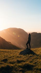 Preview wallpaper man, mountains, hill, sunlight