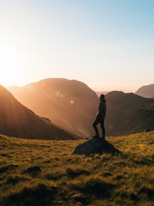 Preview wallpaper man, mountains, hill, sunlight