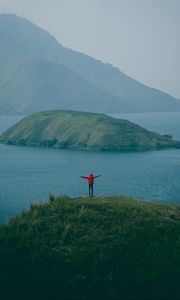 Preview wallpaper man, mountains, island, sea, fog