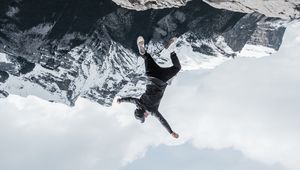 Preview wallpaper man, mountains, jump, fall, illusion