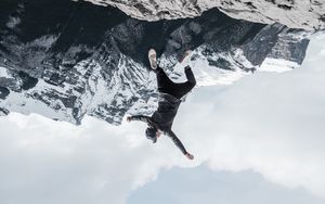 Preview wallpaper man, mountains, jump, fall, illusion