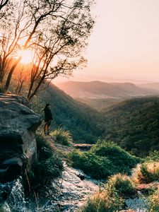 Preview wallpaper man, mountains, rocks, stream, landscape