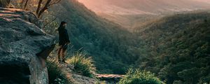 Preview wallpaper man, mountains, rocks, stream, landscape