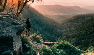 Preview wallpaper man, mountains, rocks, stream, landscape