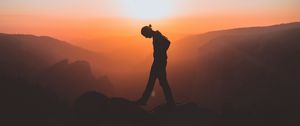 Preview wallpaper man, mountains, silhouette, sunset, solitude, freedom