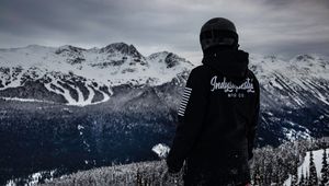 Preview wallpaper man, mountains, snowboarder, clothes, helmet