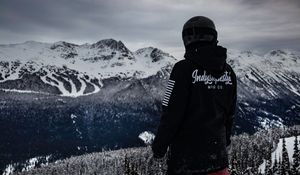 Preview wallpaper man, mountains, snowboarder, clothes, helmet