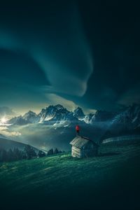 Preview wallpaper man, mountains, structure, mountain landscape, night