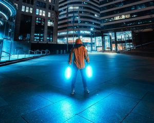 Preview wallpaper man, neon, light, city, night, buildings