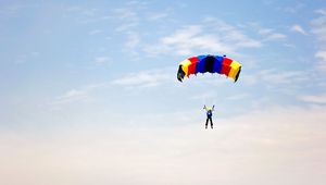 Preview wallpaper man, parachute, sky, clouds