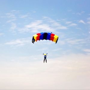 Preview wallpaper man, parachute, sky, clouds