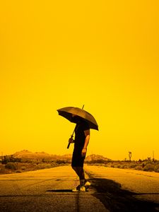 Preview wallpaper man, person, umbrella, road, sunset