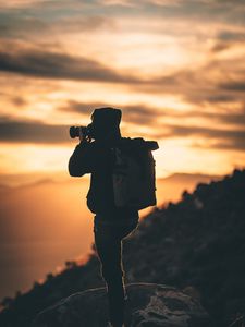 Preview wallpaper man, photographer, camera, silhouette, sunset