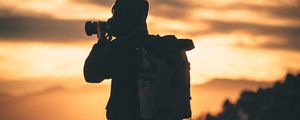 Preview wallpaper man, photographer, camera, silhouette, sunset