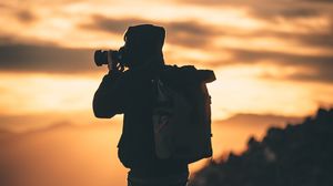 Preview wallpaper man, photographer, camera, silhouette, sunset