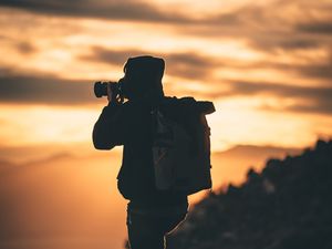 Preview wallpaper man, photographer, camera, silhouette, sunset